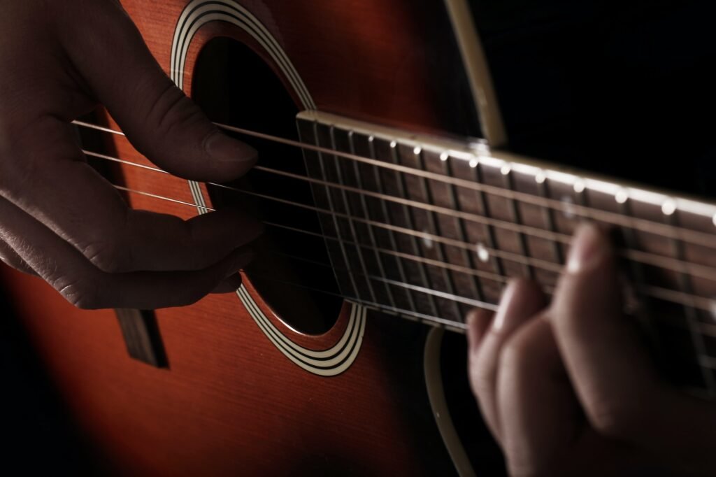 musician-playing-on-guitar